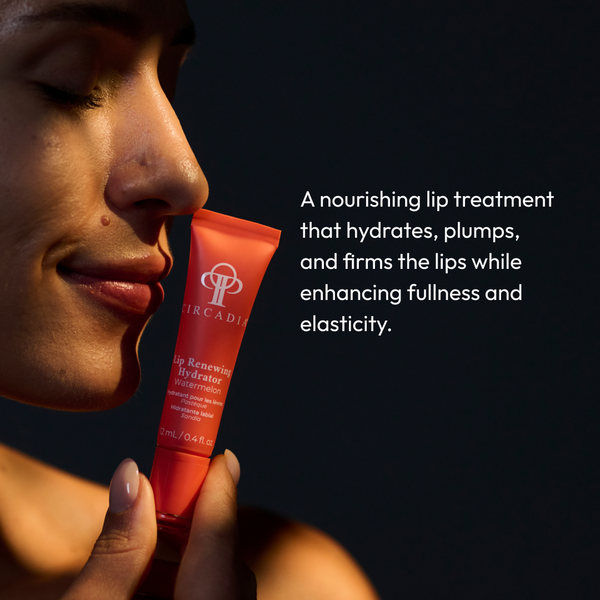 A close-up side view of a person holding a tube of Lip Renewing Hydrator - Watermelon | Circadia near their lips, highlighting a nourishing lip treatment that hydrates, plumps, and firms for enhanced fullness and elasticity.
