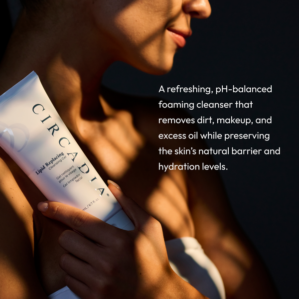Woman holding a tube of Lipid Replacing Cleansing Gel | Circadia in soft sunlight with text describing it as a pH-balanced foaming cleanser that removes dirt, makeup, and excess oil while preserving skin’s natural barrier and hydration.