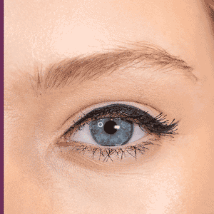 Close-up of a blue eye with natural blonde eyebrows shaped and defined, showcasing the effect of Eyebrow Pencil - Blonde | Blinc for subtle enhancement and grooming.