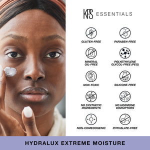 Close-up of a person applying Hydralux Extreme Moisture | Kindness Powered Skincare cream to their cheek, alongside icons highlighting the product’s gluten-free, paraben-free, mineral oil-free, polyethylene glycol-free, non-toxic, silicone-free, no synthe