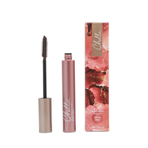Open tube of Good Drama Mascara | Chella in brown shade next to its pink and gold decorative box against a white background.