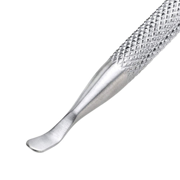 Close-up of a textured metal Pushy & Nail Cleaner | Tweezerman tool designed for precise nail care and cuticle maintenance.