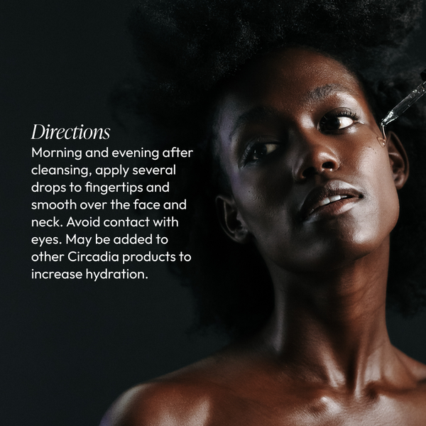 Close-up of a person applying Hydralox | Circadia hydrating oil to their face, demonstrating skincare routine directions for hydration and facial care.