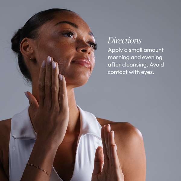 Woman with glowing skin gently touching her face demonstrating skincare routine with Vitamin C Reversal Antioxidant Serum | Circadia, with directions to apply morning and evening after cleansing.