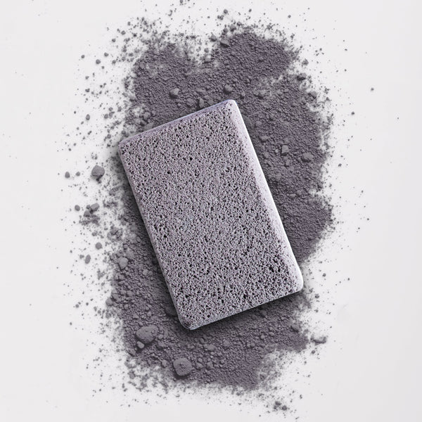 In The Buff Dual-Texture Siliglass Pumice Stone | Barefoot Scientist shown on a textured gray surface, highlighting its exfoliating and skincare benefits for body care and wellness.