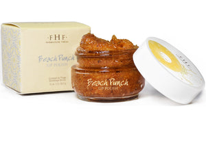 Beach Punch® Lip Polish | Farmhouse Fresh in a small jar with textured scrub visible, alongside its beige and yellow packaging, showcasing a natural skincare lip exfoliant product.