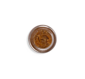 Top view of a jar containing Beach Punch® Lip Polish | Farmhouse Fresh, showing its rich, textured brown exfoliating lip treatment for skincare and body care.