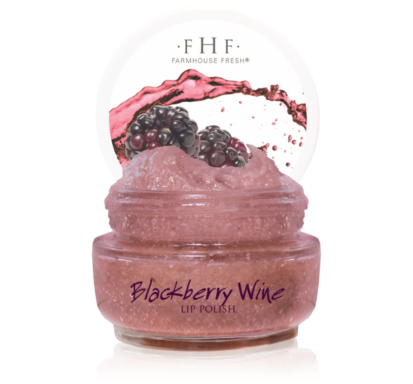 Open jar of Blackberry Wine Lip Polish | Farmhouse Fresh showing deep pink scrub texture with blackberry fruit and splash graphic on the lid packaging for skincare and body care.