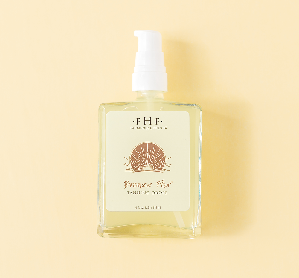 Bottle of Bronze Fox® Tanning Drops | Farmhouse Fresh with a pump dispenser against a soft yellow background, highlighting skincare and body care wellness.