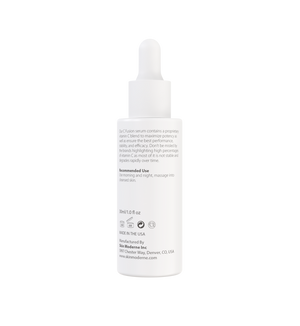White dropper bottle of C Fusion | Skin Moderne serum with text describing vitamin C blend, recommended use, and manufacturing details visible on label.