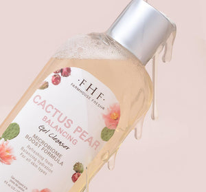 Close-up of a bubbly bottle with gel dripping from the cap, featuring Cactus Pear Balancing Gel Cleanser | Farmhouse Fresh for skincare and hydration.