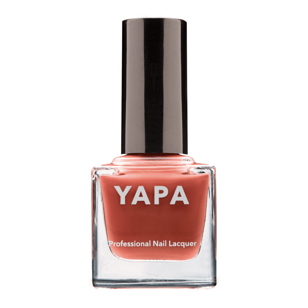 Paris Nail Lacquer | YAPA in a sleek glass bottle with a rich coral shade and black cap, designed for professional-quality nail care and vibrant color.