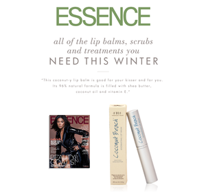 Coconut Beach® Hydrating Lip Balm | Farmhouse Fresh displayed alongside its packaging and an Essence magazine cover, highlighting its natural formula with shea butter, coconut oil, and vitamin E for winter lip care.