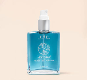 Dew Ritual® Triple Lipid Body Oil | Farmhouse Fresh in a clear glass bottle with blue body oil and a white pump dispenser, designed for skincare and body care wellness.