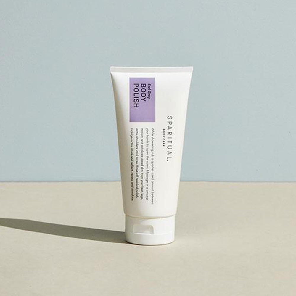 Tube of Earl Grey BODY POLISH | Sparitual standing on a neutral surface, featuring minimalist packaging designed for skincare and body care wellness routines.