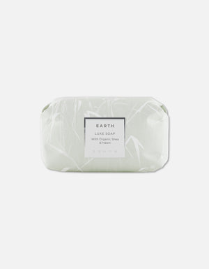 Luxe Soap Bar | Zents Earth edition wrapped in pale green packaging with delicate botanical design, promoting natural skincare with organic shea and neem for body care.