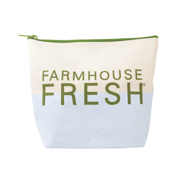 FHF Canvas Cosmetic Bag | Farmhouse Fresh features a two-tone natural and light blue canvas design with green zipper and Farmhouse Fresh logo, ideal for skincare and body care storage.