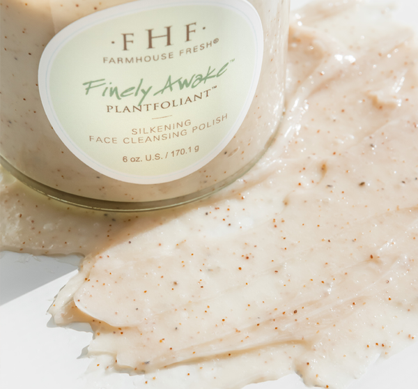 Jar of Finely Awake Plantfoliant Silkening Face Cleansing Polish | Farmhouse Fresh with creamy exfoliating scrub spread beside it, showcasing textured skincare product.