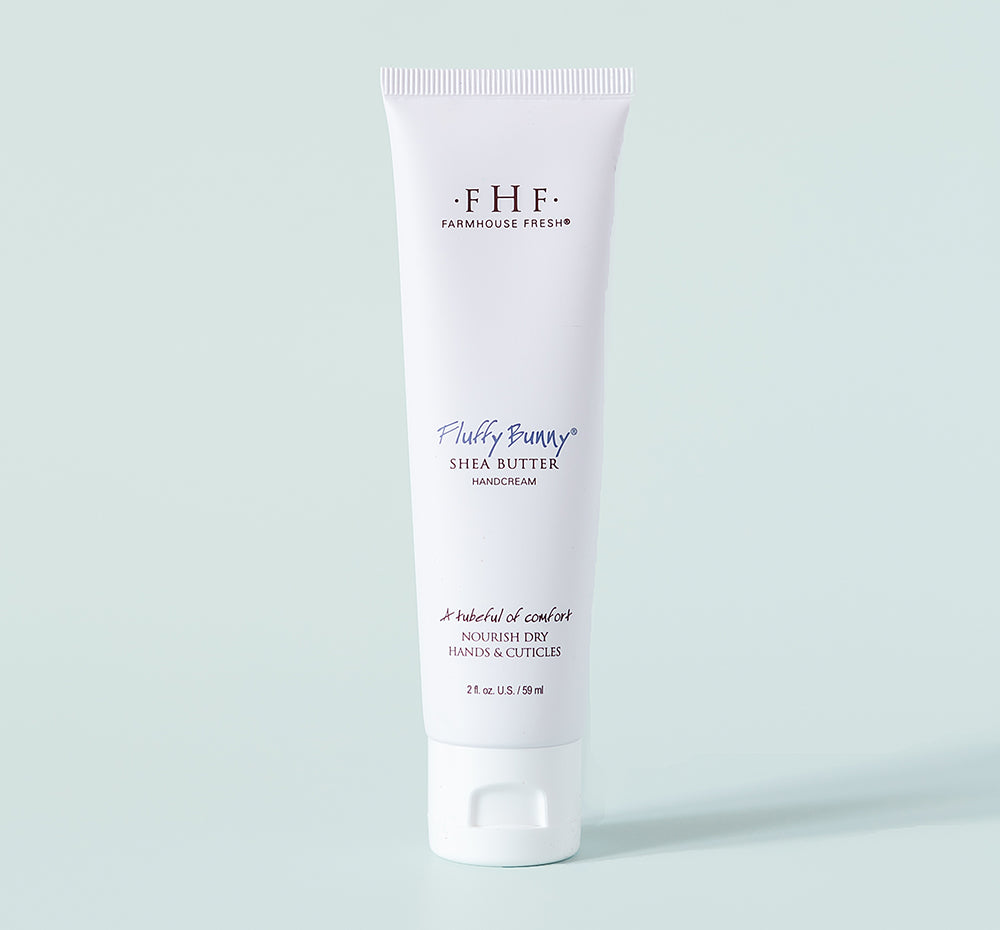 Fluffy Bunny® Shea Butter Hand Cream | Farmhouse Fresh in a white tube designed to nourish dry hands and cuticles, promoting soft and hydrated skin with rich shea butter.