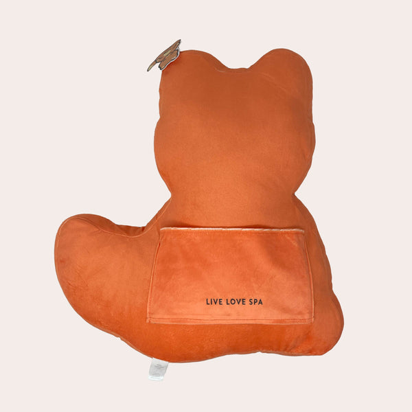 Back view of the Meditating Fox Plushie | Lucky Owl in soft orange fabric with a small pocket embroidered with Live Love Spa, designed for comfort and wellness décor.