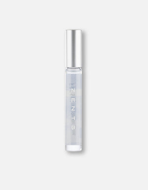 Clear cylindrical roll-on bottle with silver cap containing fragrance oil, labeled Attar Roll-on Scent | Zents, ideal for personal body care and wellness use.