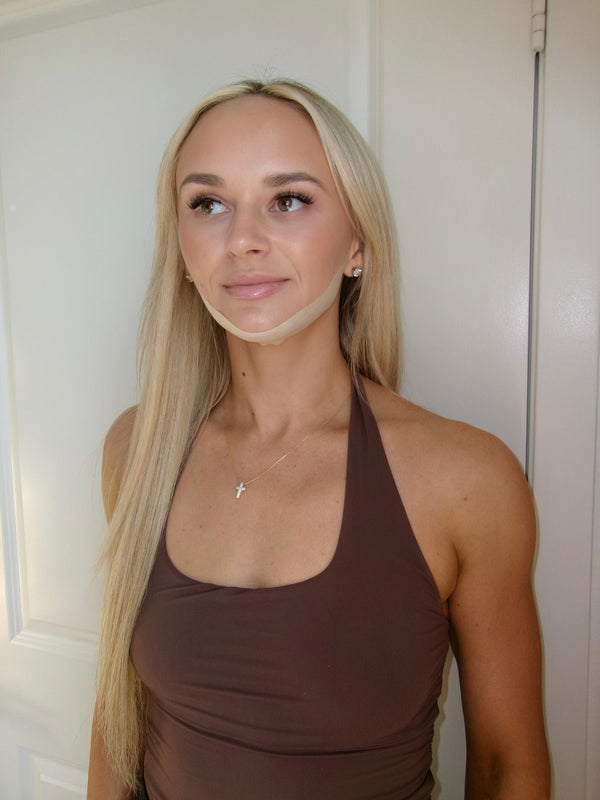 Young woman with long blonde hair wearing Jawline Sculpting Patches | Seald™ Wellness, demonstrating skincare glow and wellness care with a natural look.
