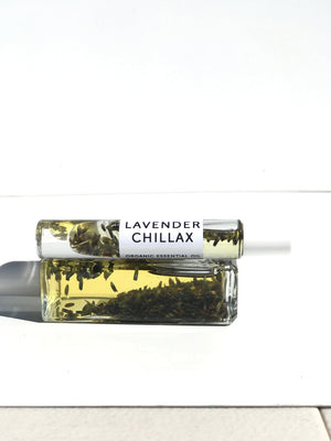 Lavender Chillax Organic Perfume Roll-on | Hydra Bloom displayed with a clear glass bottle containing lavender-infused essential oil, promoting relaxation and wellness.