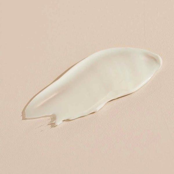 Smooth, creamy texture of Jasmine Tuberose BODY CRÈME | Sparitual on a soft beige background, highlighting rich skincare for body care and wellness.
