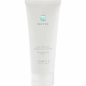 White tube of Age Defying Probiotic Lotion | Zents from the Water collection, featuring minimalist design and labeled with organic shea and lotus ingredients for skincare.