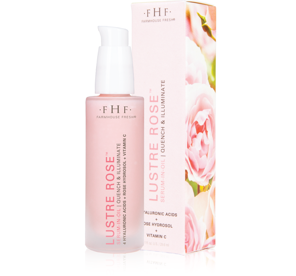 Lustre Rose™ Serum-in-Oil | Farmhouse Fresh in a pink frosted bottle with a white pump, displayed next to its matching floral-themed packaging, highlighting skincare and wellness.