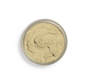 Top view of a creamy green facial mask in a clear jar, showcasing the smooth texture of Matcha Purity™ Calm & Clear Purification Mask | FarmHouse Fresh for skincare.