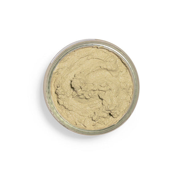 Top view of a creamy green facial mask in a clear jar, showcasing the smooth texture of Matcha Purity™ Calm & Clear Purification Mask | FarmHouse Fresh for skincare.