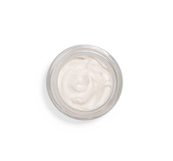 Top view of a jar filled with smooth white facial mousse from Moon Dip® Youthful Complexion Ageless Facial Mousse with Peptides + Retinol | Farmhouse Fresh, showcasing skincare product texture.