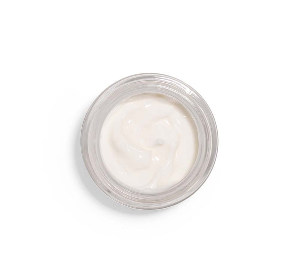 Top view of creamy white skincare product in a clear jar from the Silky, Milky & Most Loved Naked Nourishment Set | Farmhouse Fresh, showcasing smooth texture for body care and wellness.