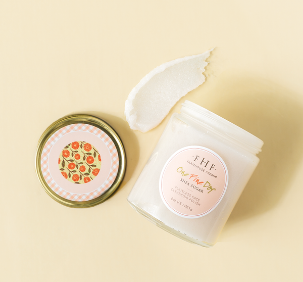 One Fine Day Flawless Face Polish | Farmhouse Fresh jar open with creamy shea sugar face polish texture on a light beige background for skincare and body care.