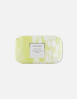 Luxe Soap Bar | Zents wrapped in light green and white floral-patterned paper featuring a label that highlights organic shea and neem ingredients for skincare and body care.
