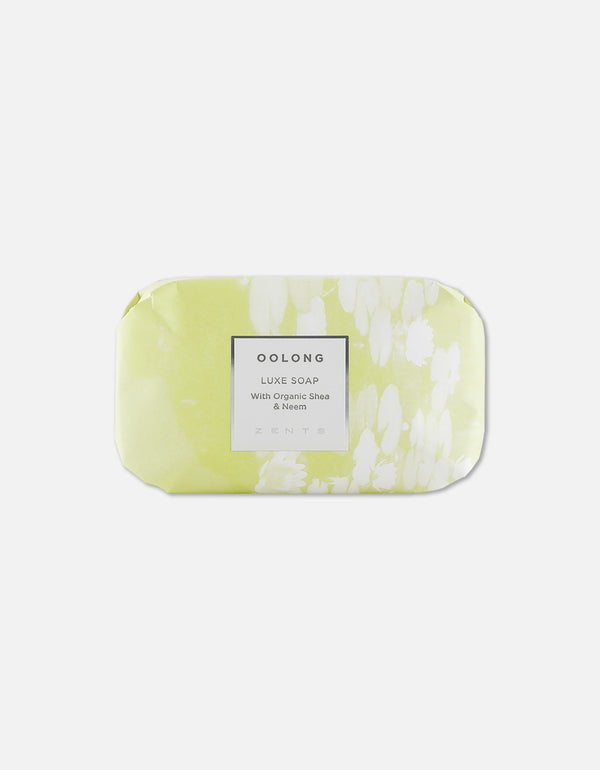 Luxe Soap Bar | Zents wrapped in light green and white floral-patterned paper featuring a label that highlights organic shea and neem ingredients for skincare and body care.