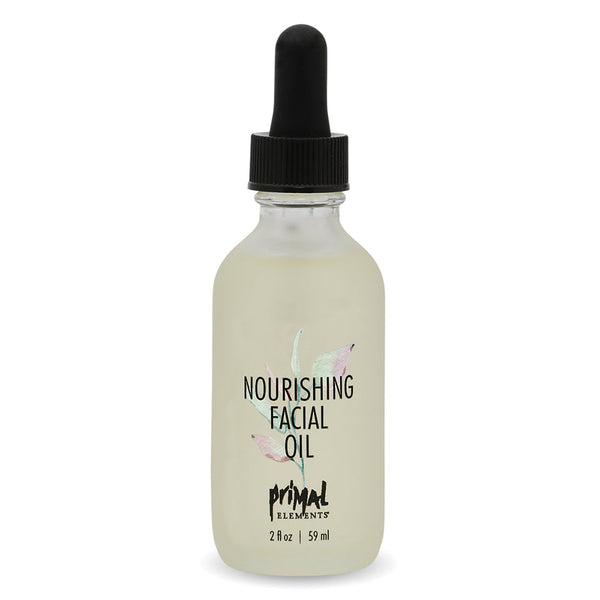 Clear glass bottle of Nourishing Facial Oil | Primal Elements with a black dropper cap, featuring simple leaf design and soft neutral tones for skincare and wellness.