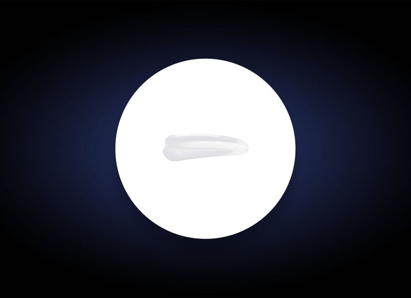 Close-up of a smooth, translucent swatch of Ideal Complex¨ Revitalizing Eye Gel | PCA Skin on a white circular background, highlighting its lightweight skincare texture.