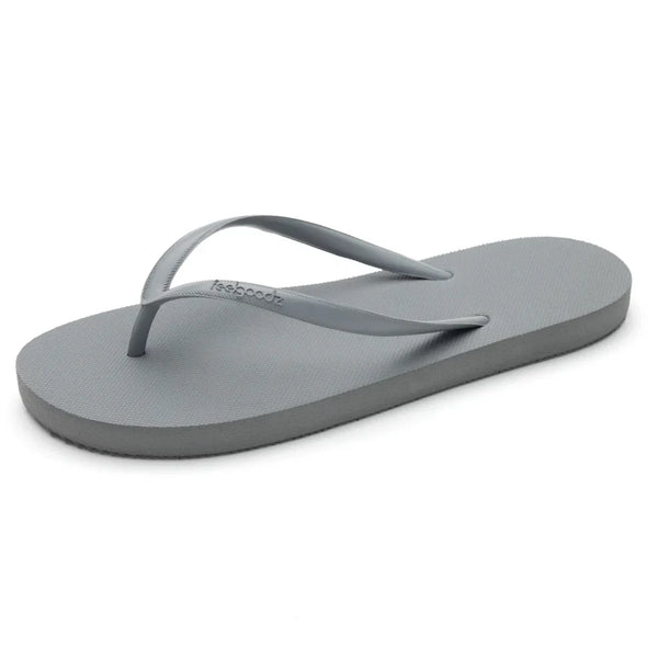 Single light gray flip flop sandal with thin straps, designed for casual wear, showcasing the Slimz Core Sandals | Feelgoodz style.