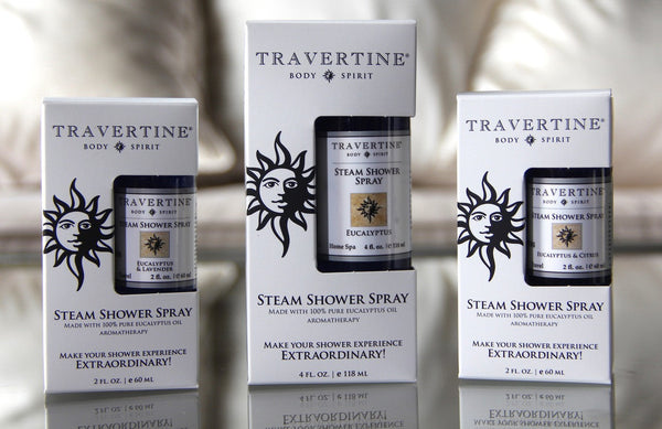 Three sizes of Travertine Body & Spirit steam shower spray bottles in packaging, featuring Eucalyptus + Lavender Steam Shower Spray | Travertine Spa for aromatherapy and wellness.