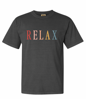 Black crew neck t-shirt with the word RELAX in multicolored retro-style letters across the chest, featuring the product title RELAX Retro Unisex T-Shirt | Lucky Owl.