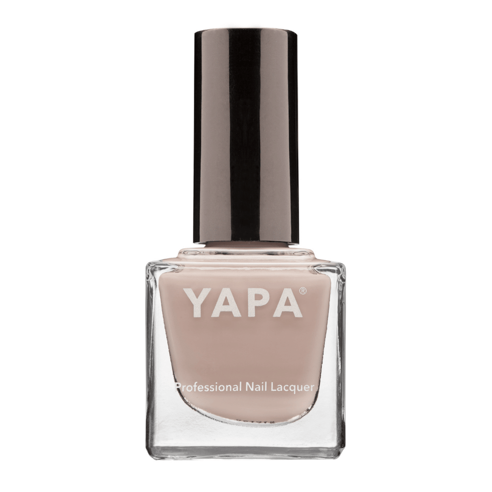 Bottle of Sophia Nail Lacquer | YAPA in a neutral beige shade with a sleek black cap, designed for professional nail care and polish application.