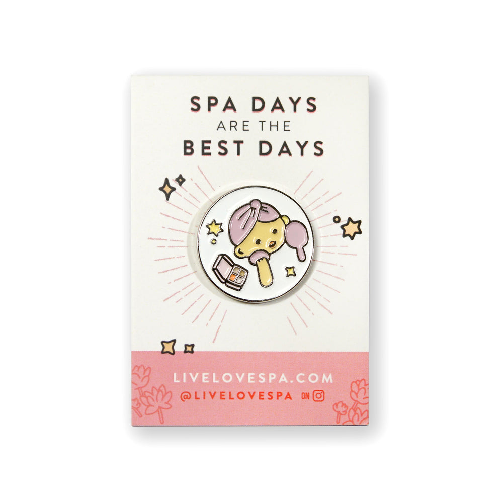 Fab Spa Life Enamel Pin - Limited Edition | Lucky Owl featuring a cute owl wearing a pink spa headband, holding a brush and jar of skincare cream, promoting wellness and self-care.