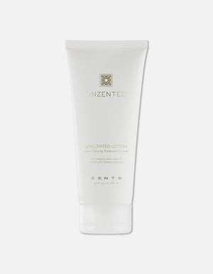 Minimalist white tube of Age Defying Probiotic Lotion | Zents with subtle gold lettering, highlighting its unscented formula designed for skincare and body care wellness.