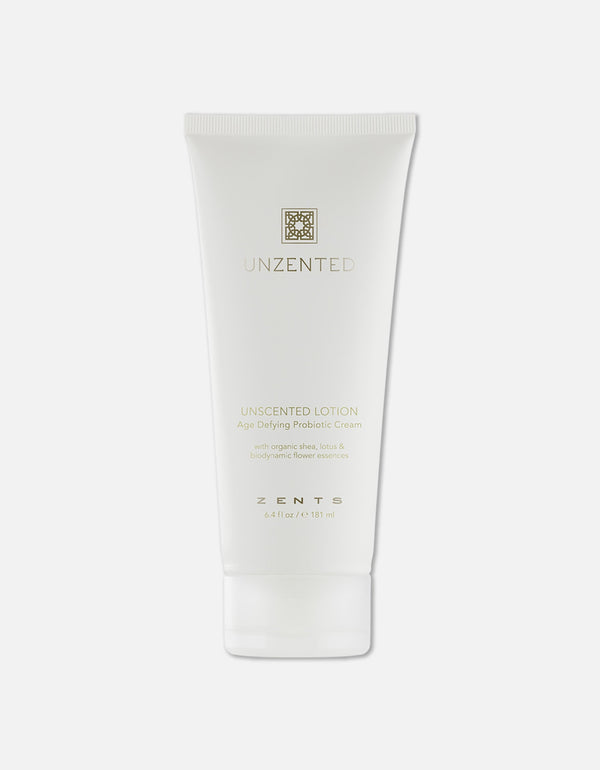 Minimalist white tube of Age Defying Probiotic Lotion | Zents with subtle gold lettering, highlighting its unscented formula designed for skincare and body care wellness.