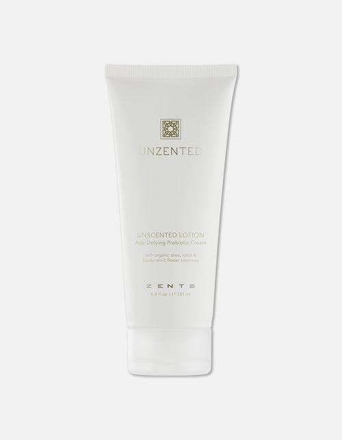 Minimalist white tube of Age Defying Probiotic Lotion | Zents with subtle gold lettering, highlighting its unscented formula designed for skincare and body care wellness.