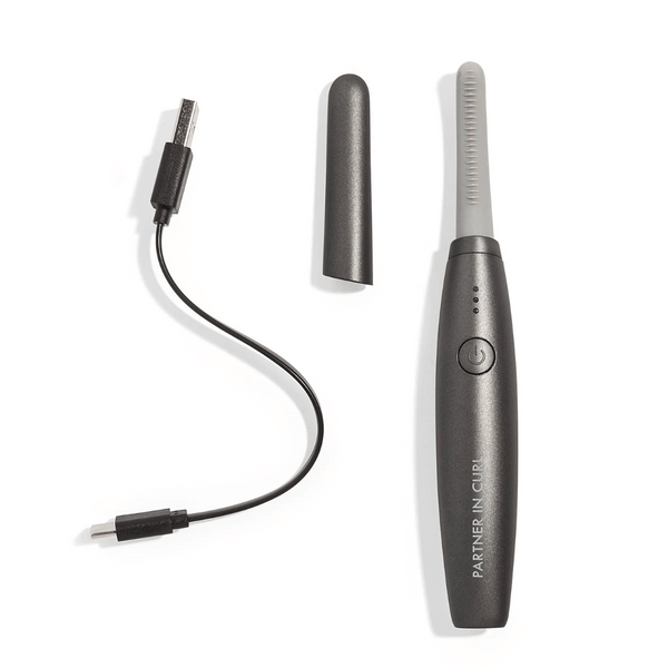Deluxe Heated Eyelash Curler | Chella with protective cap and USB charging cable, sleek black design ideal for gentle and effective eyelash curling in skincare and wellness routines.