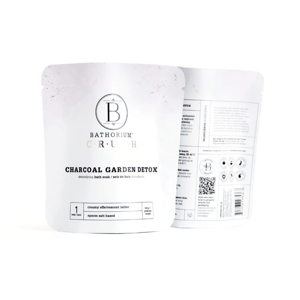 Charcoal Garden Detox Crush | Bathorium detoxifying bath soak in white resealable pouches, featuring creamy effervescent lather and epson salt base for skincare and body care wellness.