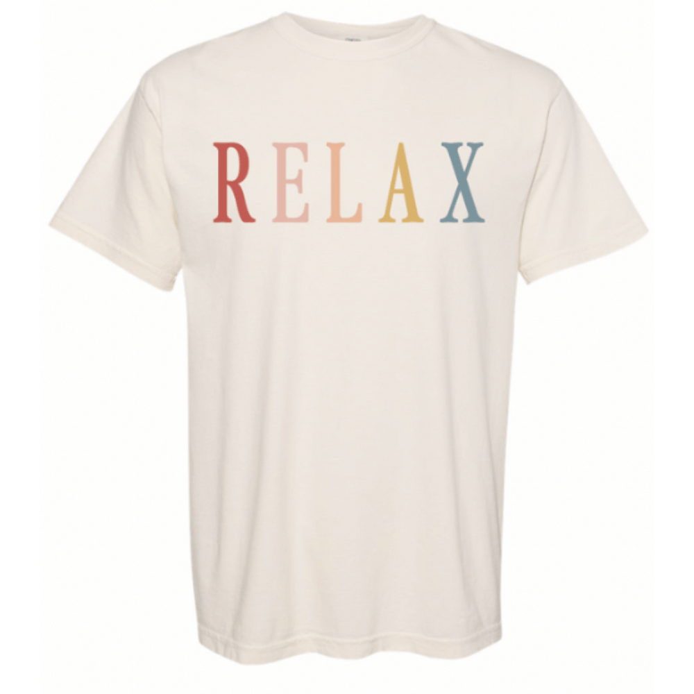 Cream-colored unisex t-shirt featuring the word RELAX in retro multicolored letters, designed for casual and comfortable wear, titled RELAX Retro Unisex T-Shirt | Lucky Owl.
